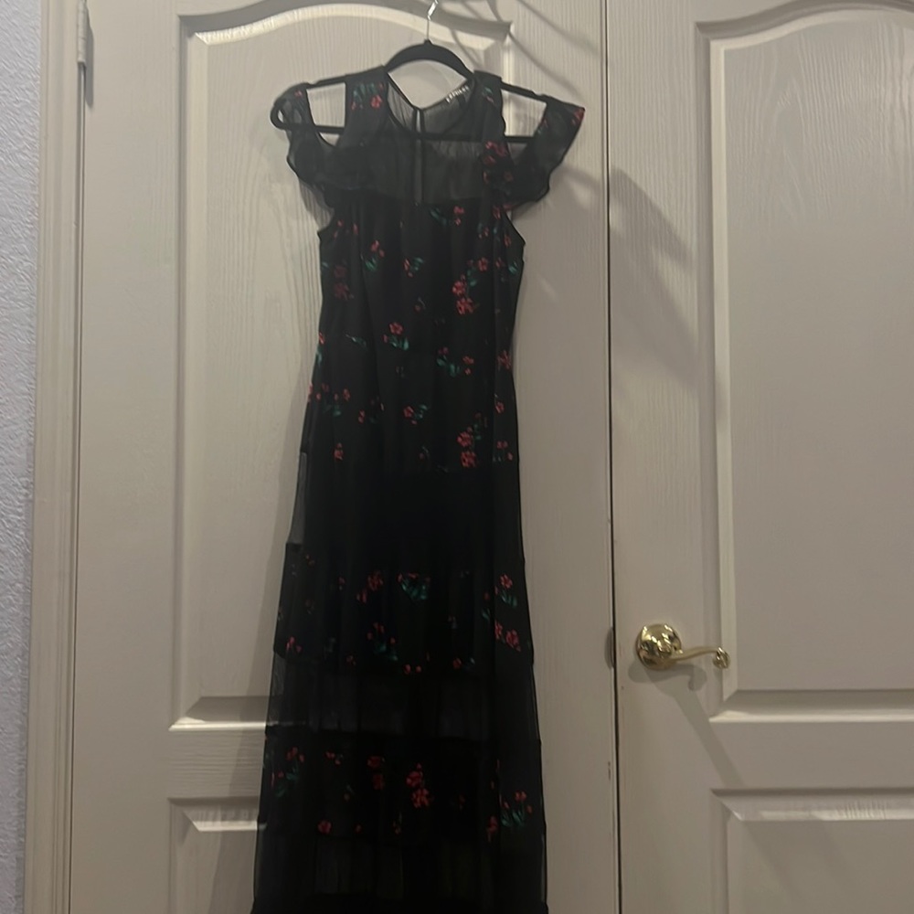 Express maxi dress with sheer and off shoulder detail.